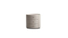 Front view of the Neru nightstand featuring a circular 3-drawer silhouette wrapped in light grey leather with contrasting top stitching