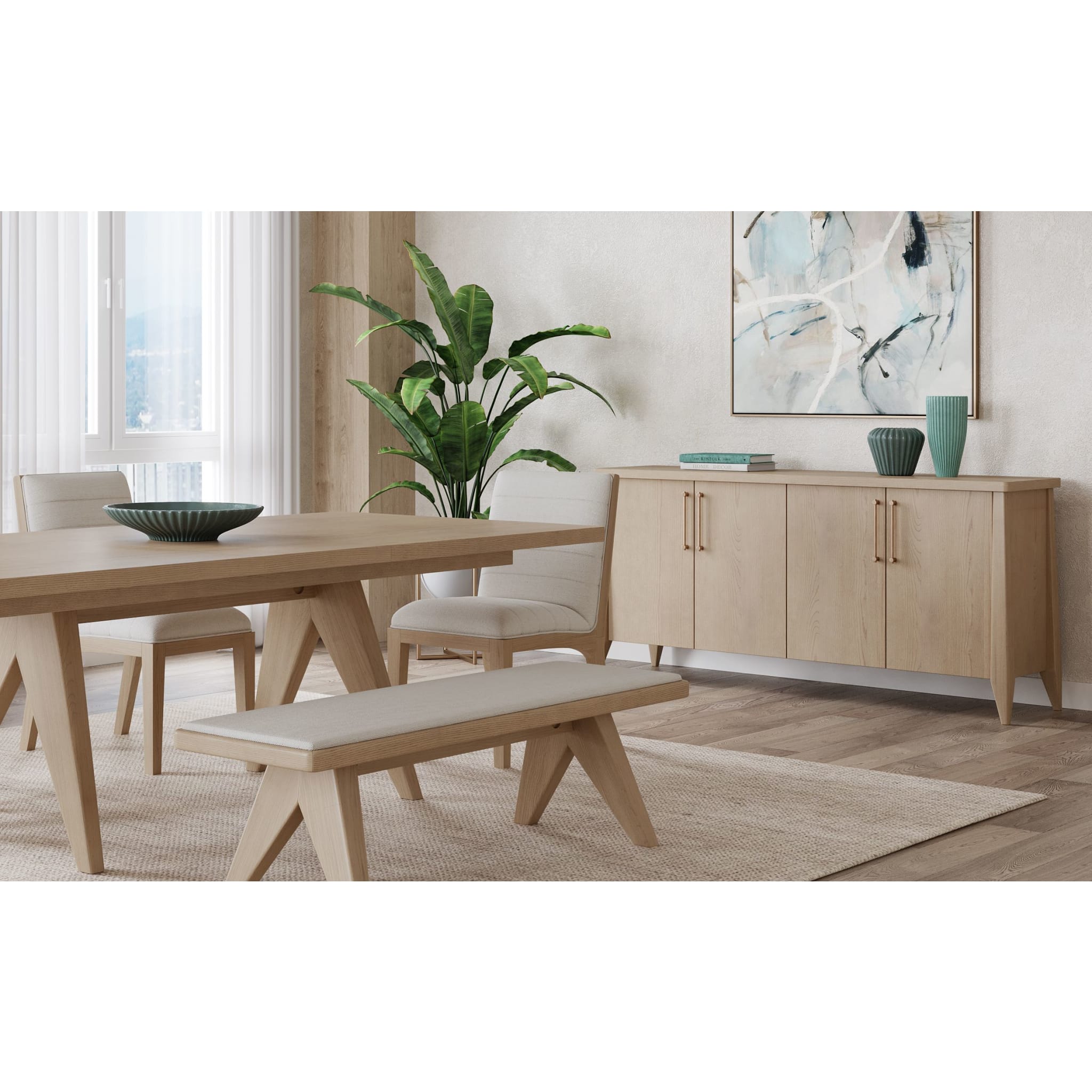 Nettie sideboard styled with a matching dining table and bench in a light wood finish