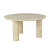 Perspective view emphasizing the low-profile silhouette and the solid stone construction of the Nils coffee table