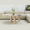 Interior shot of the Nils coffee table styled with a decorative vase and greenery in a modern living space
