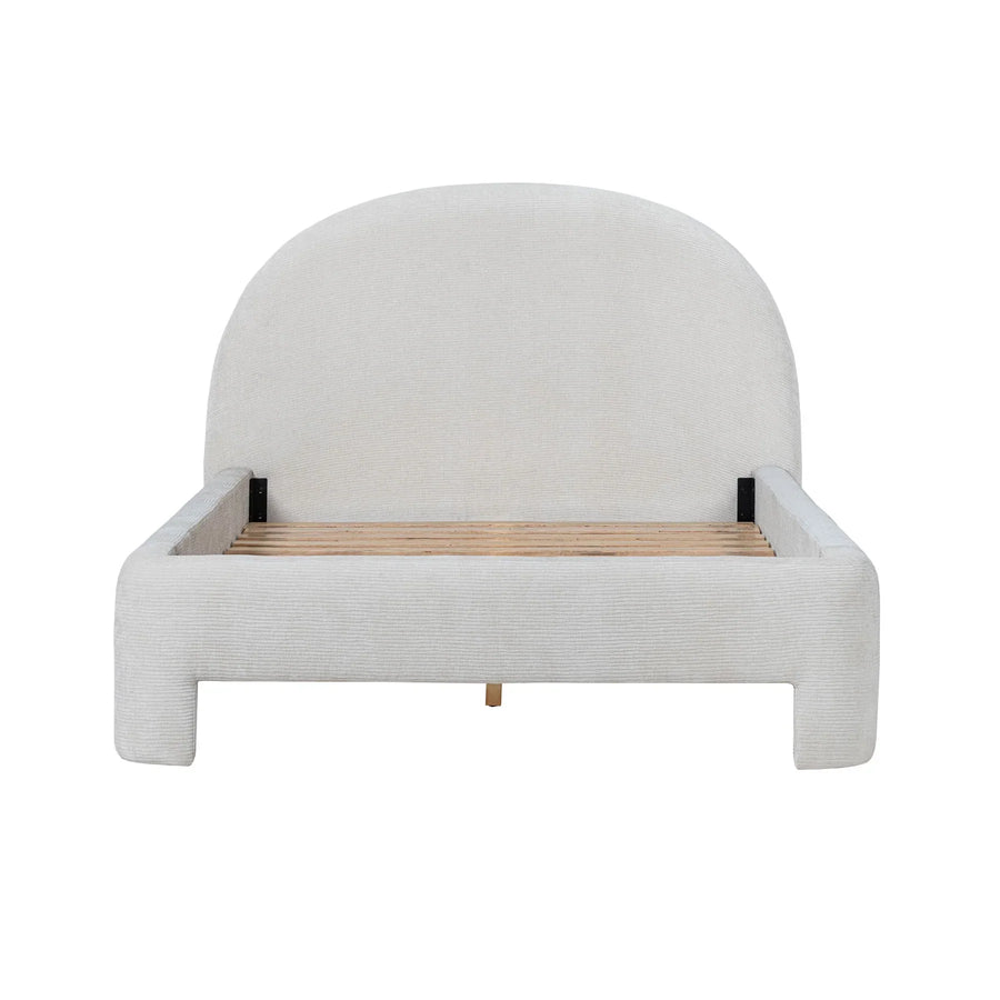 Front view of the Nina platform bed featuring a tall arched headboard and a thick, textured cream bouclé frame