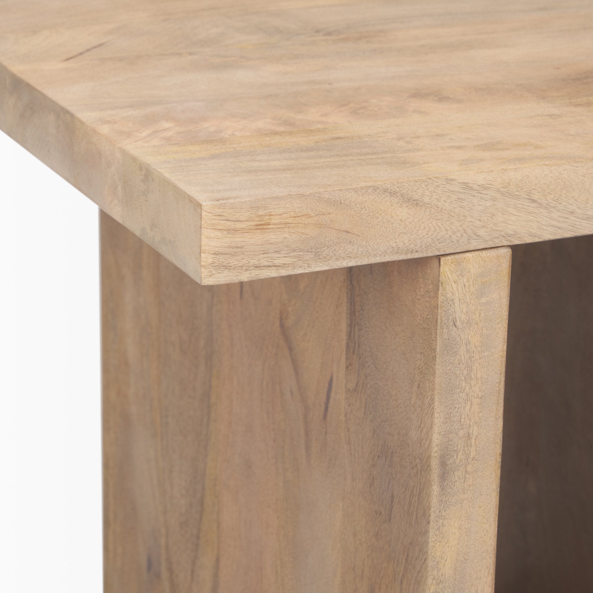 Straight-on front view highlighting the architectural H-frame silhouette and symmetrical design of the light brown wood table