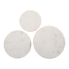 Direct overhead view of the three circular white marble tabletops showcasing unique grey veining patterns on each piece