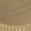 Close-up shot focusing on the high-quality craftsmanship of the fluted tambour base and the beveled edge of the tabletop