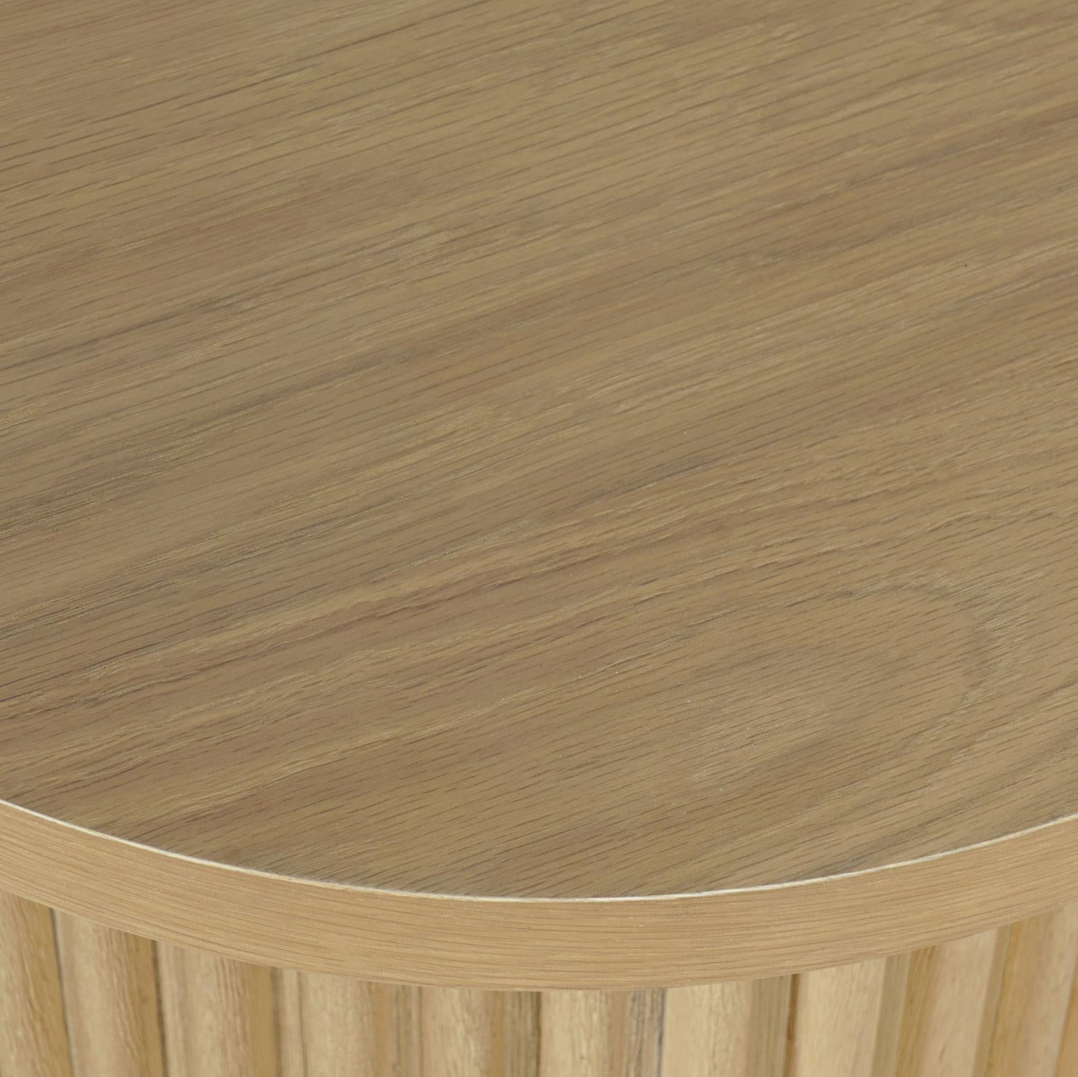 Close-up shot focusing on the high-quality craftsmanship of the fluted tambour base and the beveled edge of the tabletop