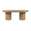 Front view of the Nord dining table in a natural oak finish featuring an oval tabletop and two thick fluted pedestal bases