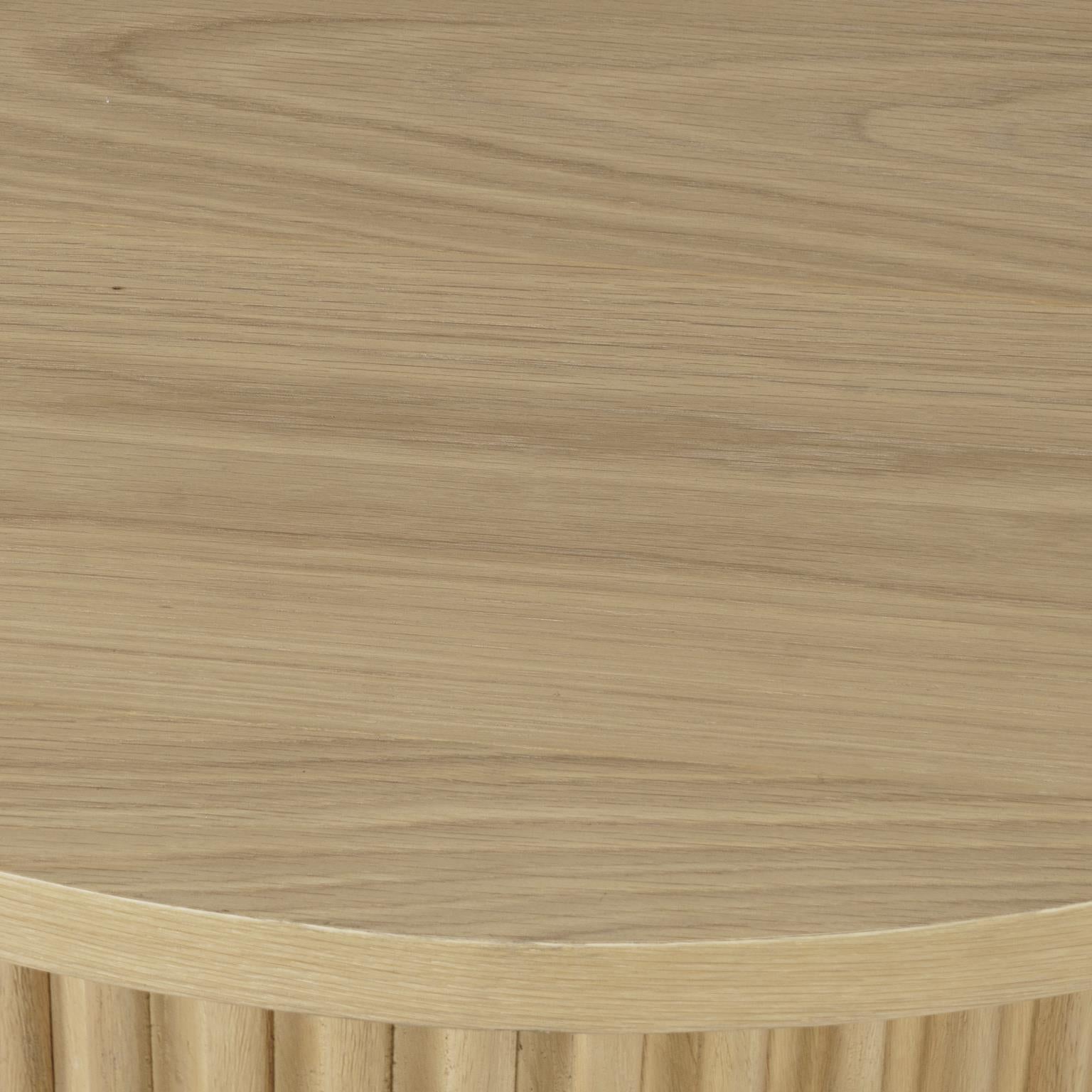 Macro detail shot showcasing the natural oak wood grain patterns and smooth finish of the tabletop