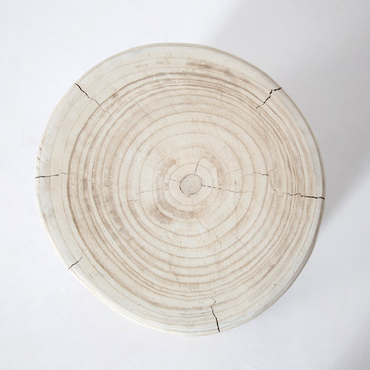 Direct overhead view highlighting the intricate natural tree ring patterns and authentic wood grain of the circular stump