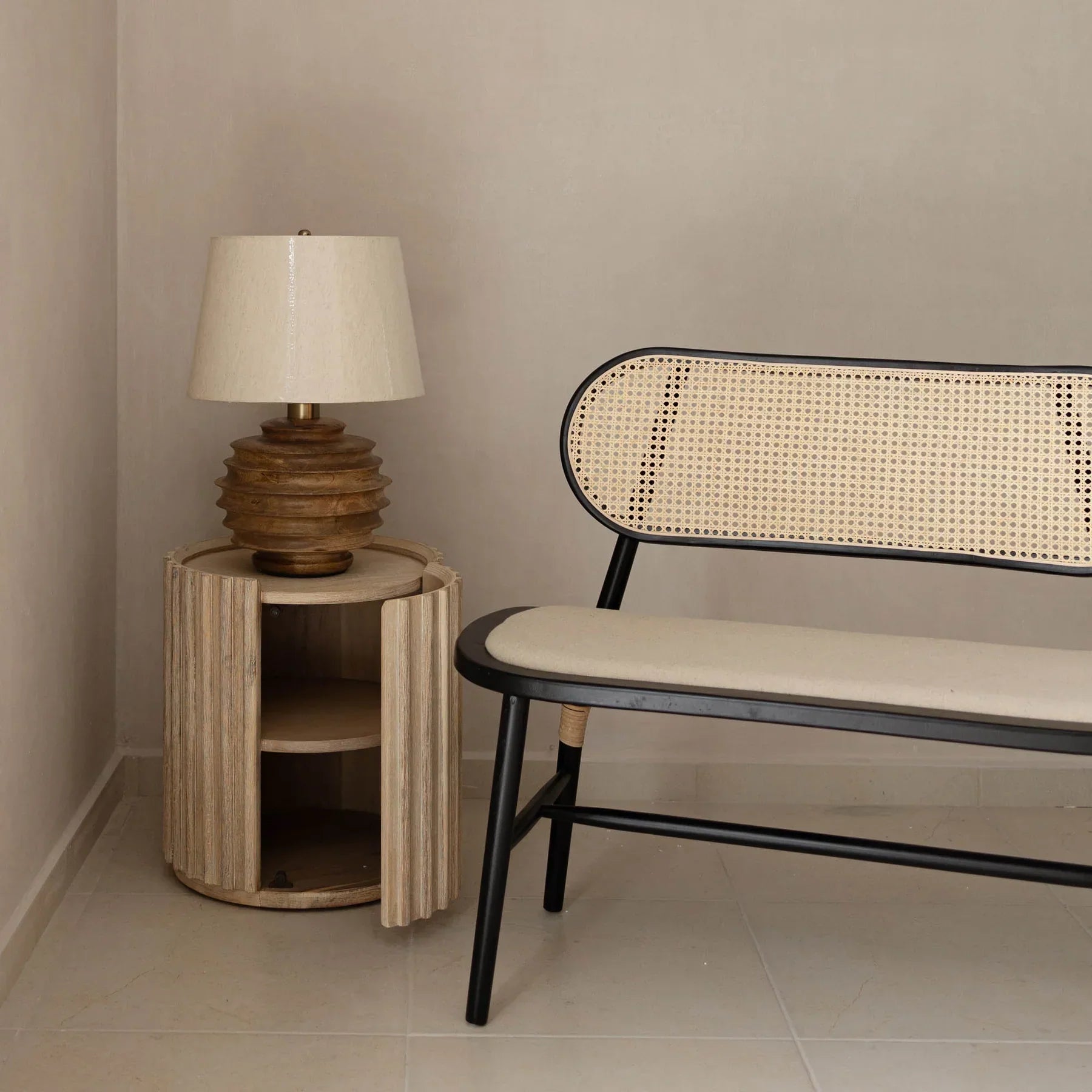 Front view of the Oasis drum-style side table featuring a vertical ribbed texture and a light oak wood finish