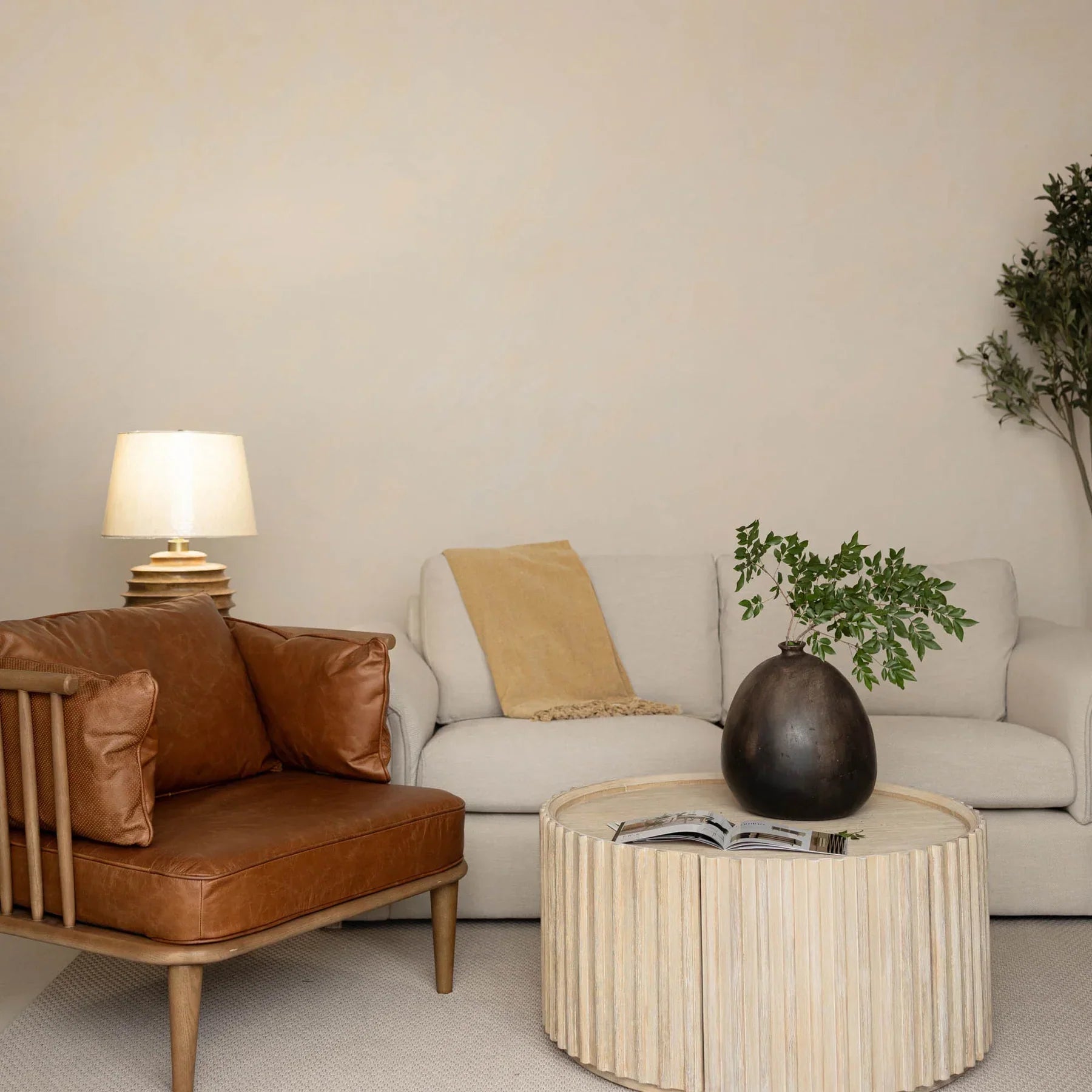 Front view of the Oasis rectangular coffee table featuring a clear glass top and a minimalist metal frame