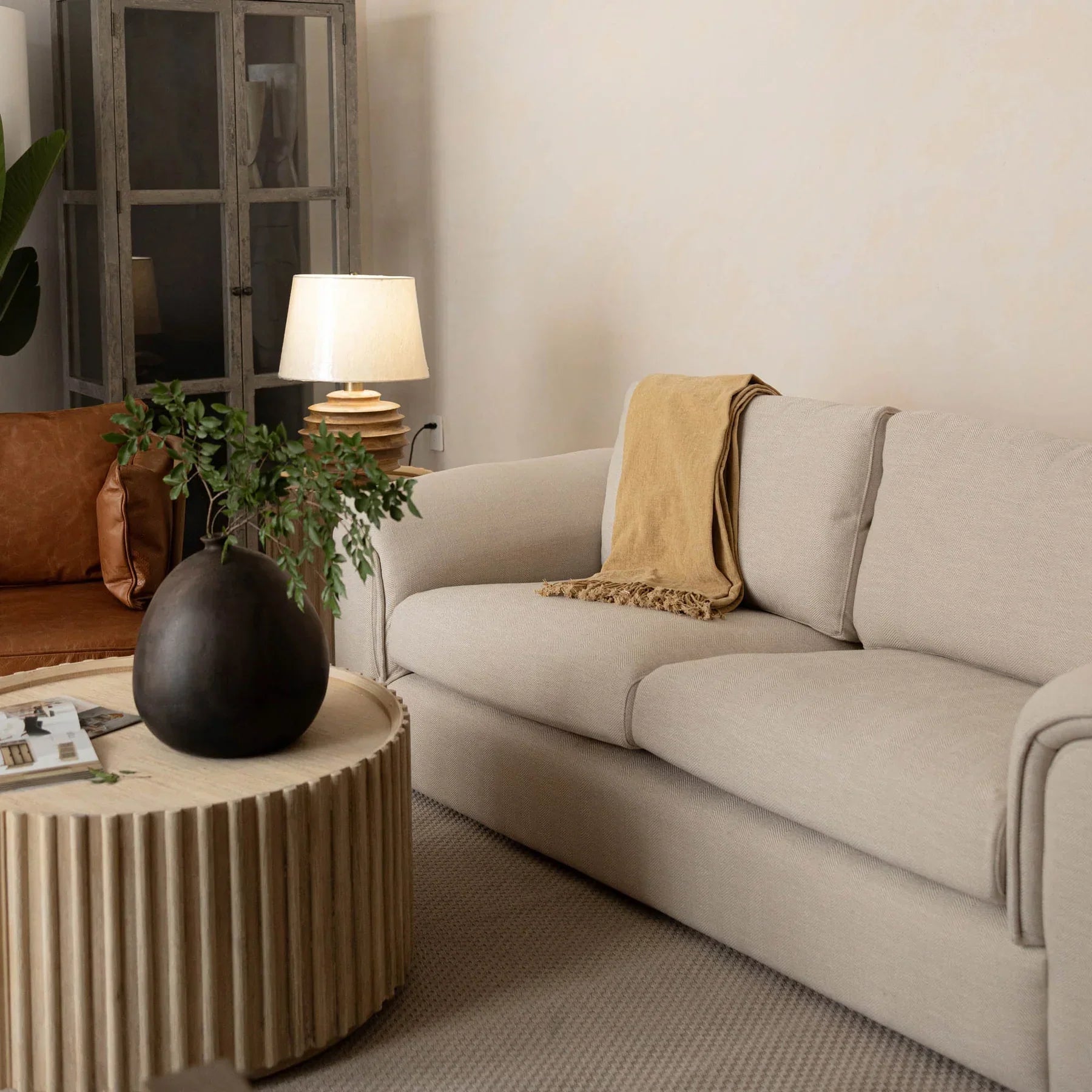 Front view of the Oasis rectangular coffee table featuring a clear glass top and a minimalist metal frame