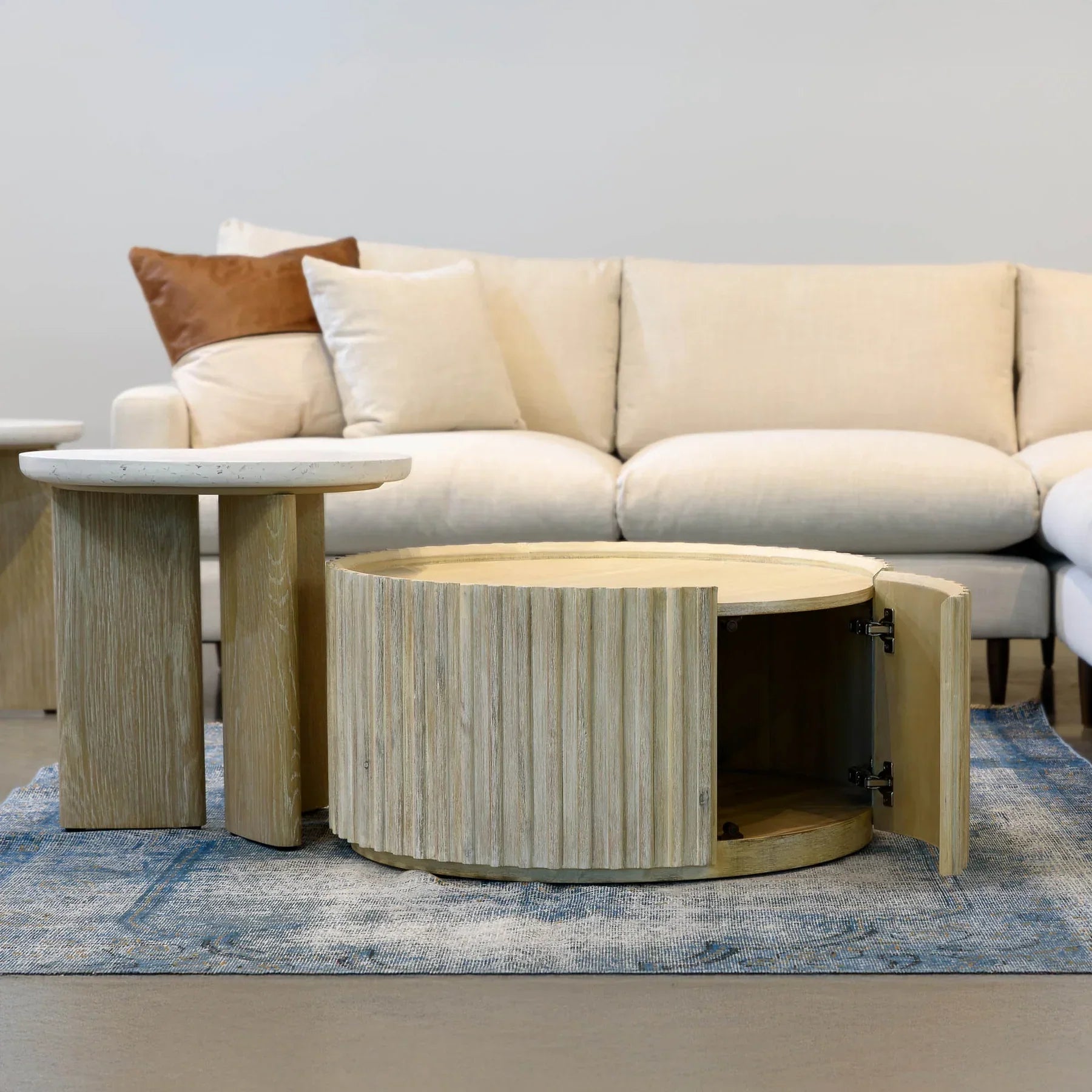 Front view of the Oasis rectangular coffee table featuring a clear glass top and a minimalist metal frame
