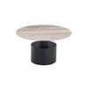 Alternative angled shot showcasing the contrast between the organic stone tabletop and the smooth matte black metal pedestal