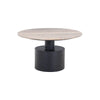 Three-quarter perspective highlighting the thin profile of the travertine surface and the stepped architectural design of the black base