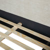 Oceana king bed with sturdy wooden slat support system and upholstered frame detail.