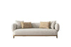Odense 3-seater sofa in beige fabric with rounded arms, wooden base, and four decorative toss pillows