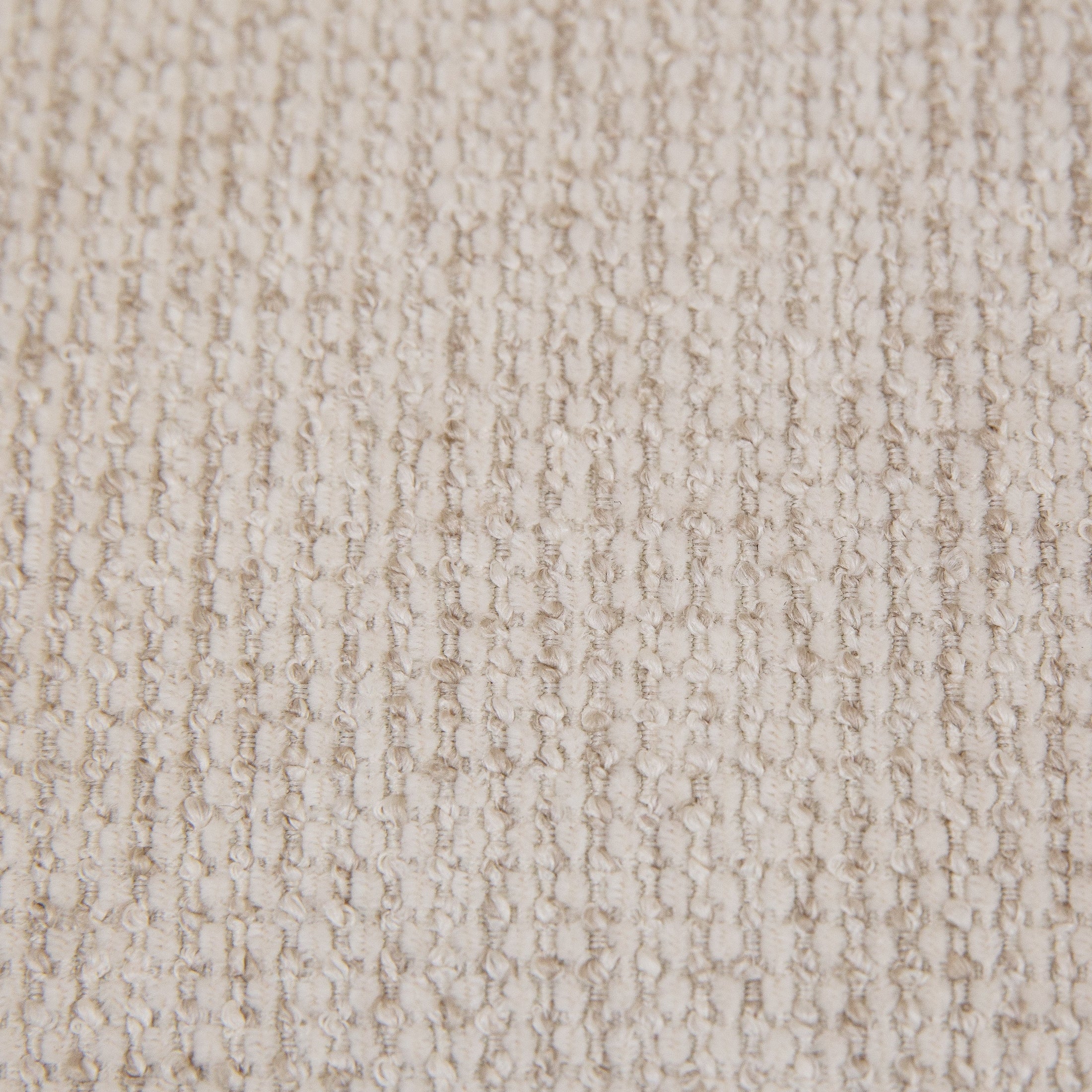 Front view of the Idony Accent Chair in off-white textured bouclé with a dark wood frame and black metal legs