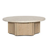 Front view of the Oja coffee table featuring a circular cream stone top and a natural fluted wood pedestal base