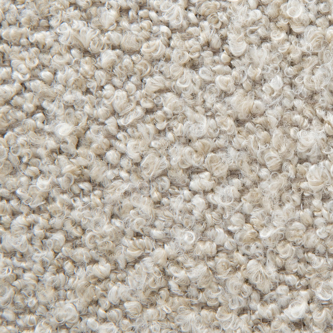 Macro shot of the olive green bouclé material highlighting the rich color and weave