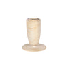 High-angle shot highlighting the expansive circular tabletop and the subtle earthy textures of the natural travertine