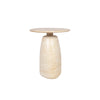 Three-quarter view of the Olympia side table featuring a circular stone top and a thick rounded pedestal base in warm cream travertine