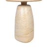 Detailed view of the cylindrical base showcasing the natural geological variations and warm tones of the cream travertine