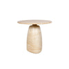 Close-up perspective of the tabletop surface emphasizing the natural pitting and rich mineral character of the cream stone