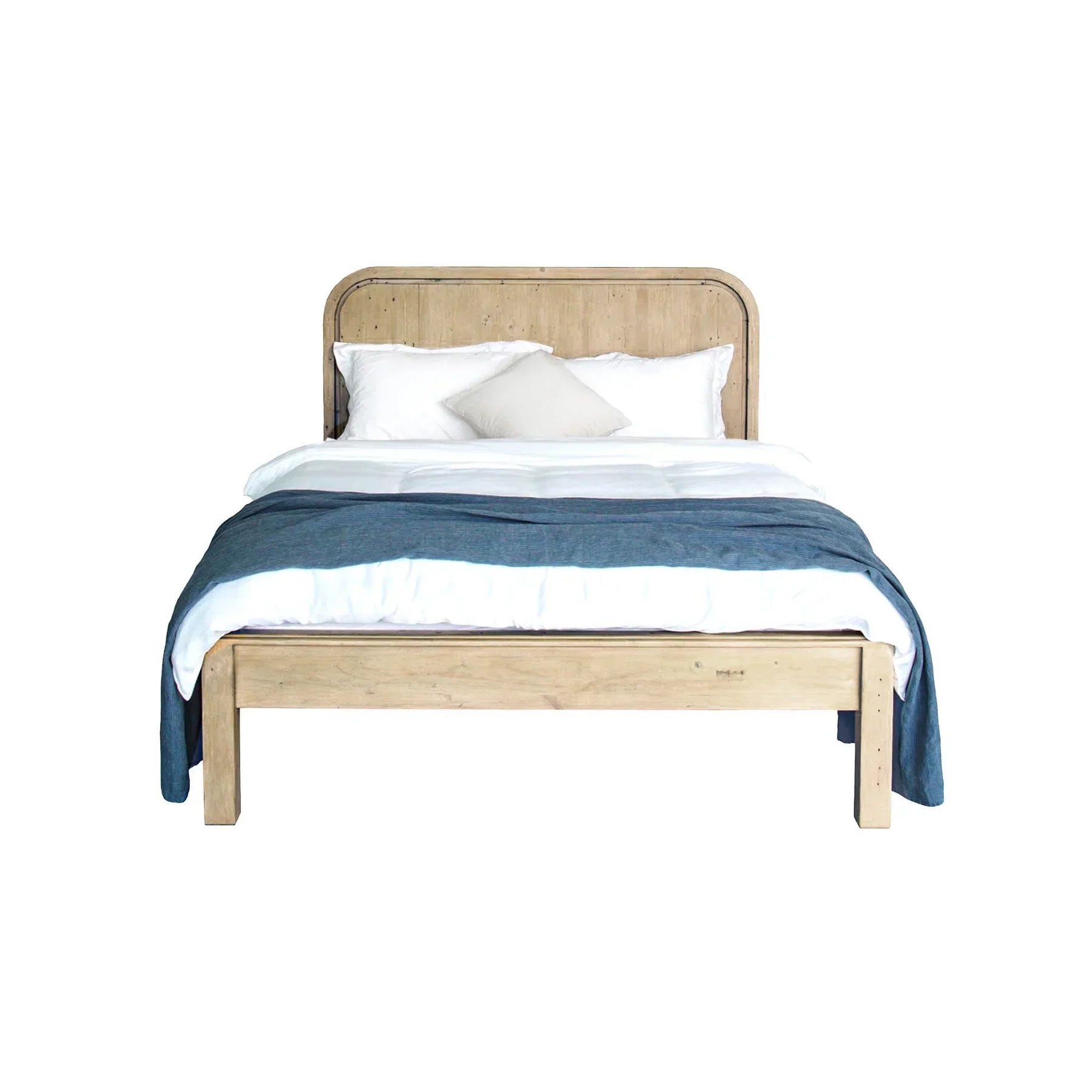 Straight-on studio view of the bed styled with pillows and a white duvet highlighting the integrated slat system