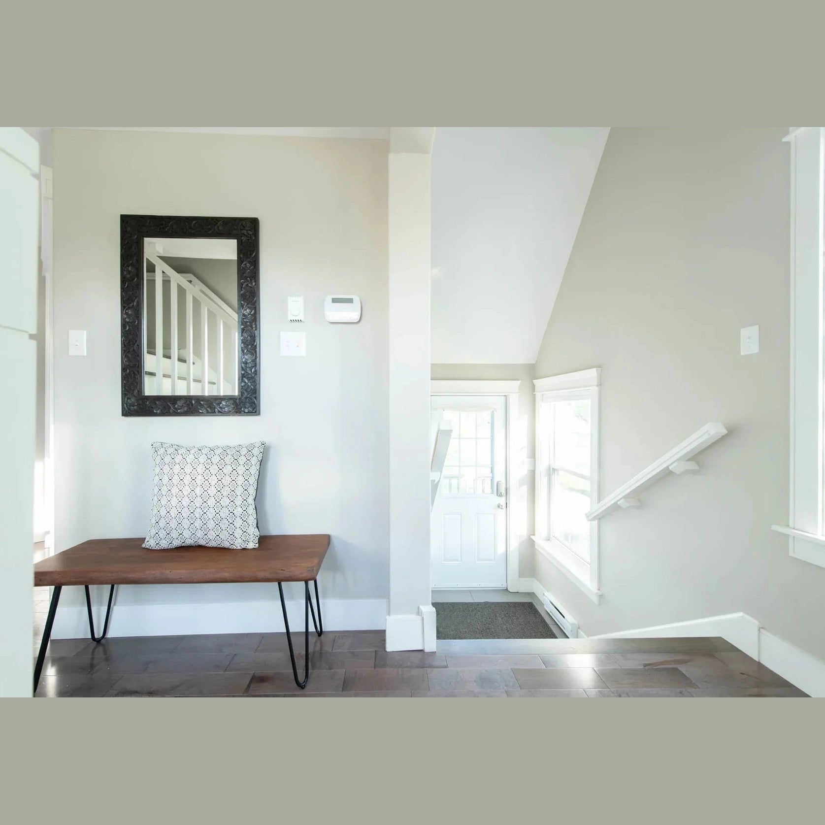 Front three-quarter view of the Organic bench featuring a matte brown live-edge wood top and black metal hairpin legs