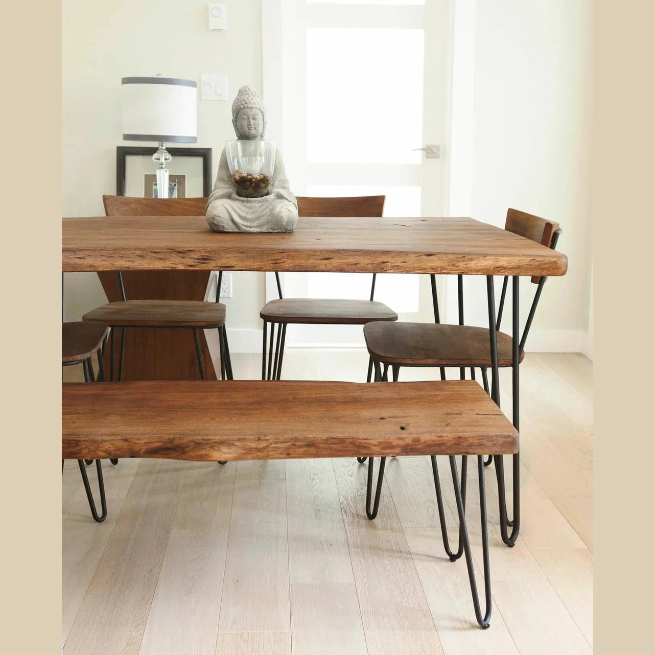 Front three-quarter view of the Organic bench featuring a matte brown live-edge wood top and black metal hairpin legs