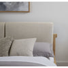 Final lifestyle perspective featuring the bed styled with plush gray bedding in a warm contemporary room setting