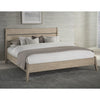 Final lifestyle perspective featuring the bed styled with plush gray bedding in a warm contemporary room setting