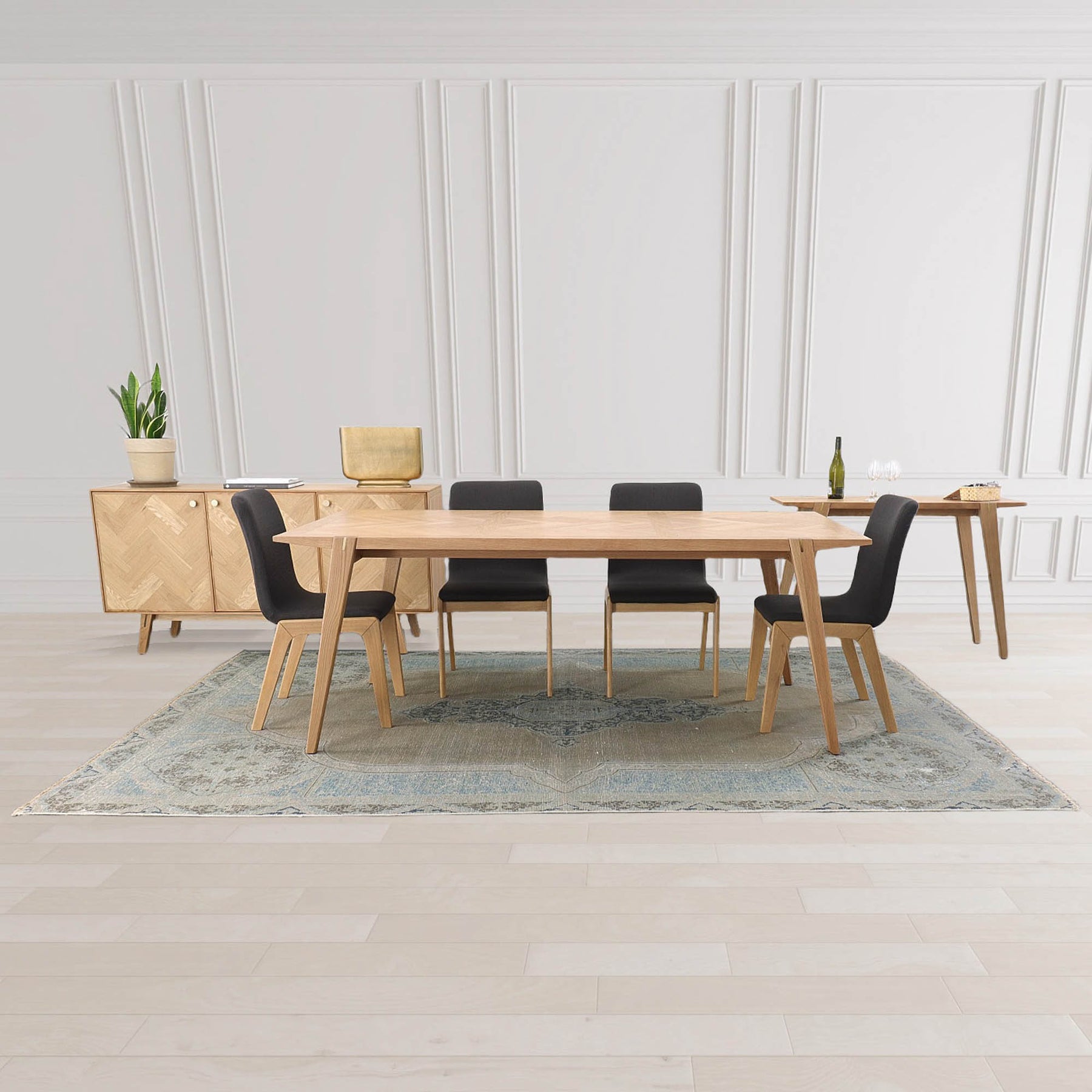 Straight-on front view of the Colton sideboard featuring a light natural oak finish and intricate herringbone parquet patterns across three cabinet doors