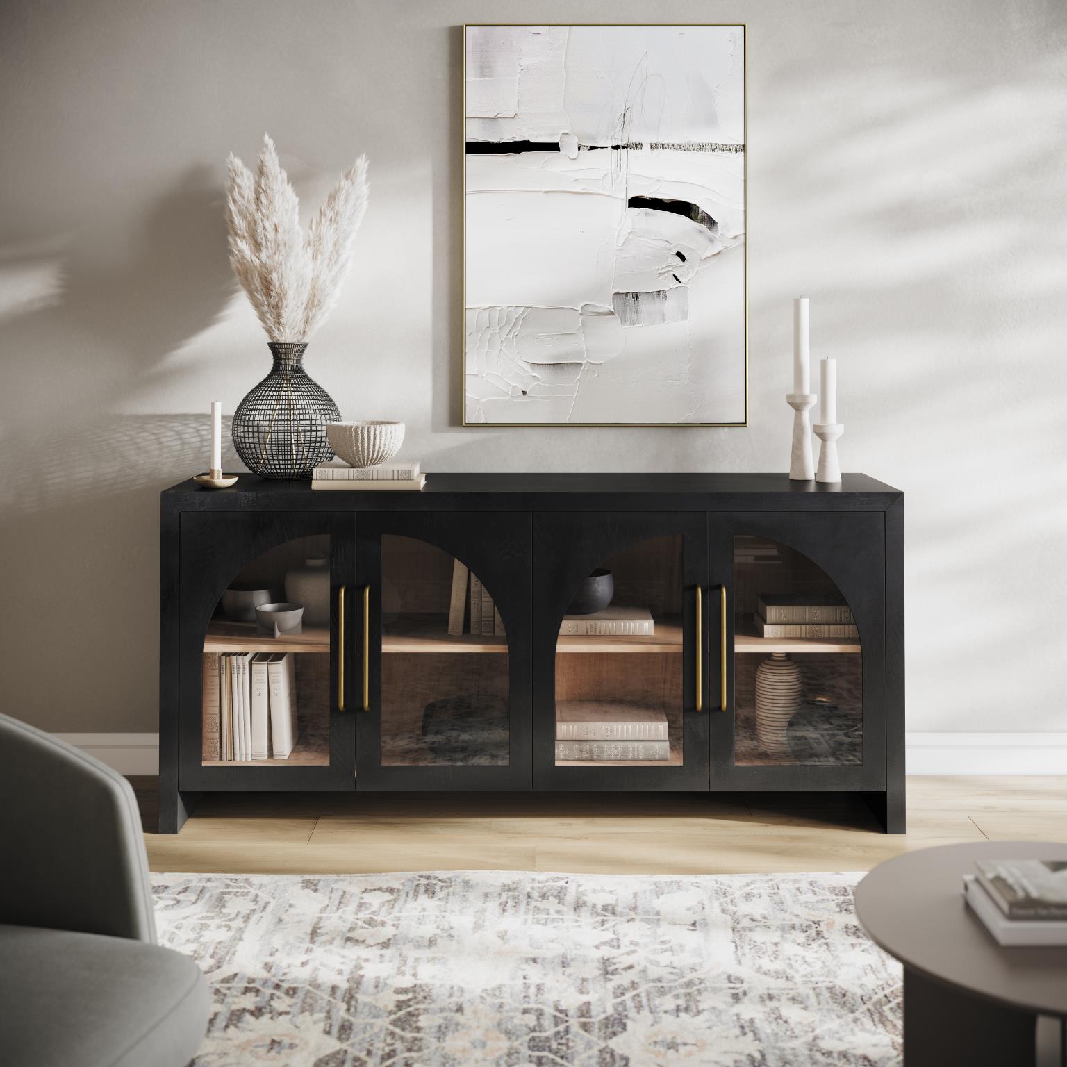 Lifestyle shot featuring the Archimedes ebony console styled in a contemporary space with textured decor and a designer rug