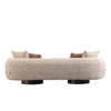 Back view of Ovolo 3-seater curved sofa in cream textured fabric with rounded modern design and wooden bases