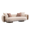 Ovolo 3-Seater Curved Sofa in beige textured upholstery with rounded arms and wooden panel details, angled front view
