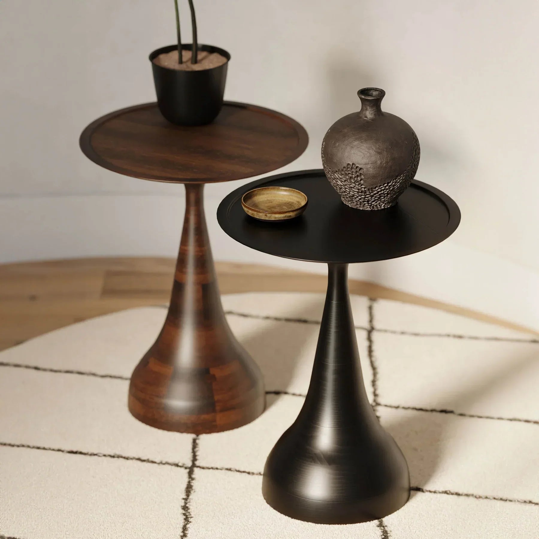 Three-quarter view of the Polina side table featuring a circular white marble top and a sculptural bronze-finished circular pedestal base