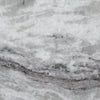 Close-up macro shot highlighting the reflective polished finish and deep charcoal mineral streaks of the authentic stone