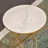 High-angle close-up emphasizing the reflective finish and unique natural patterns of the circular stone tabletop