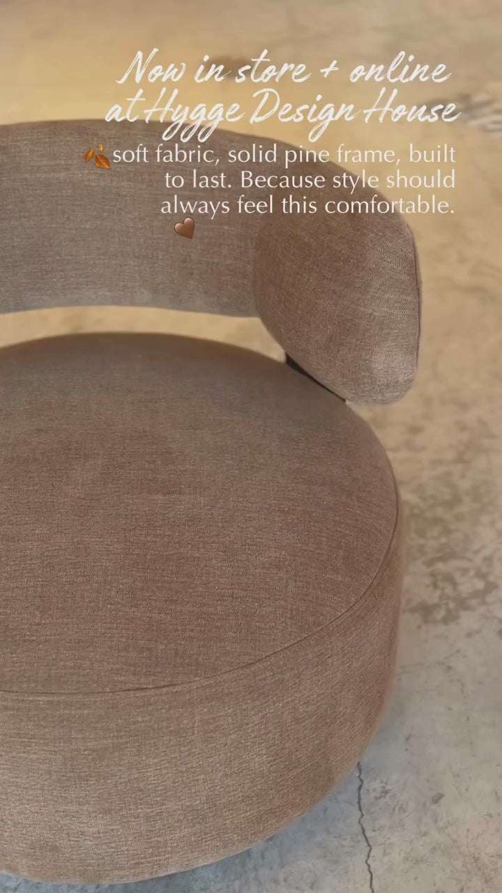 Close-up perspective from video highlighting the seamless joinery between the upholstered backrest and the dark wood base