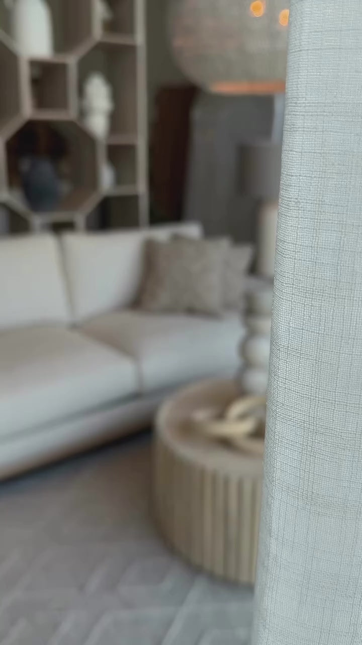 Front view of Mylo 3-seater cream sofa with wood base
