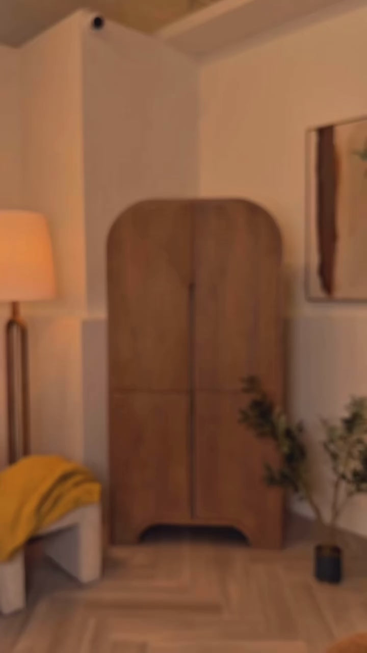 Front view of the Sorina curio cabinet featuring a light brown wood finish and a striking reverse fluted arched design