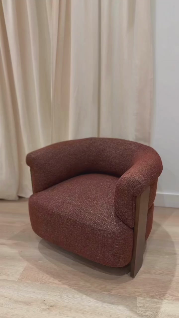 Video preview of the rust Stave chair styled in a minimalist room highlighting its rich texture and sculptural wood backrest