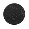Direct overhead view showcasing the unique natural white mineral veining across the polished black marble circular surface