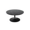 Front view of the Primo coffee table featuring a circular black marble top with white veining and a black metal tulip pedestal base