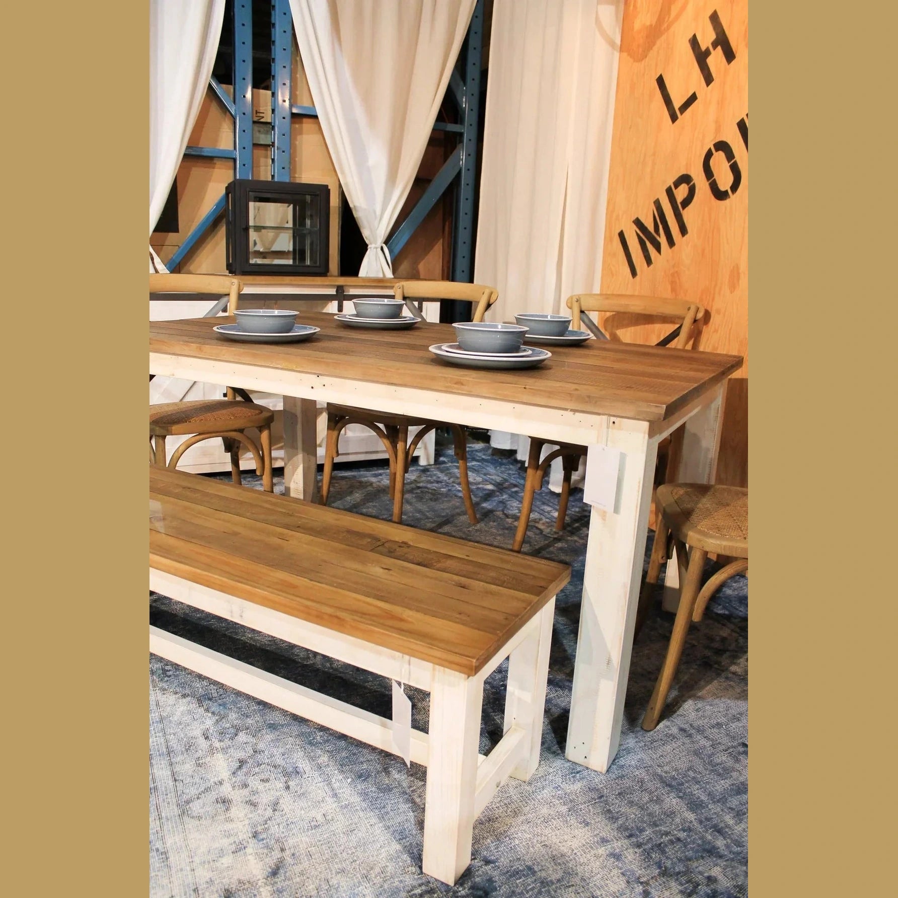 Front view of the Provence bench featuring a distressed white base and a solid natural wood plank top
