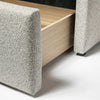 High-angle shot of the extended storage drawer showcasing the smooth pull-out functionality and neutral interior
