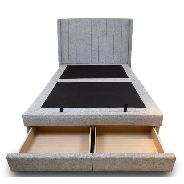 Front view of the Norell storage bed featuring a neutral woven fabric finish and a vertical channel tufted headboard