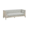 Angled view of Raphael sofa with soft curves and modern minimalist frame