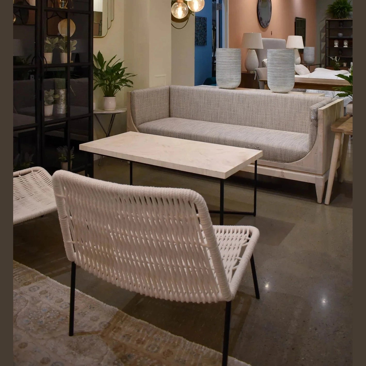 Raphael sofa front view with curved silhouette and architectural pastel design